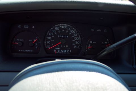 2001 Ford Crown Victoria - Interior view of a vehicle's dashboard gauges, including speedometer and tachometer.