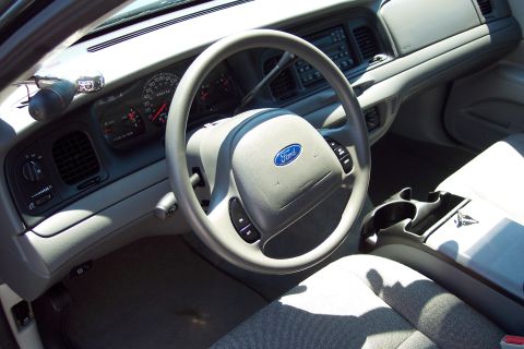 2001 Ford Crown Victoria - The interior of a 2001 Ford Crown Victoria shows the dashboard, steering wheel, and center console.