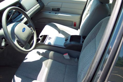 2001 Ford Crown Victoria - Interior view of a 2001 Ford Crown Victoria, showing the front seats, dashboard, and steering wheel.