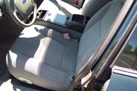 2001 Ford Crown Victoria - Interior view of a 2001 Ford Crown Victoria, focusing on the passenger seat and center console.