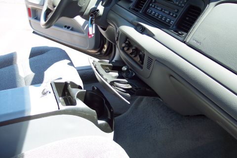 2001 Ford Crown Victoria - Interior view of a car, showing the dashboard, steering wheel, and center console.
