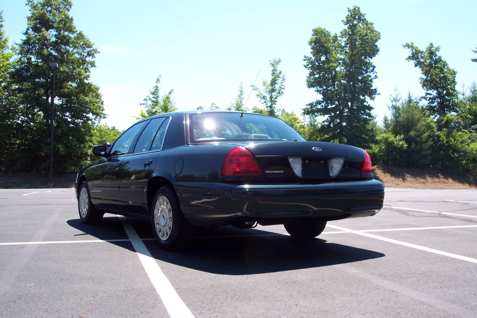 Dark green 2001 Ford Crown Victoria, rear view