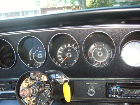 1973 Ford Ranchero - Interior view of the dashboard gauges, including the speedometer, fuel, and temperature indicators, in a 1973 Ford Ranchero.