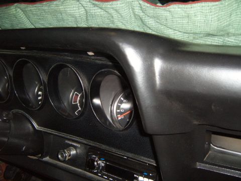 1973 Ford Ranchero - The interior dashboard of a 1973 Ford Ranchero displays its gauges and radio unit.