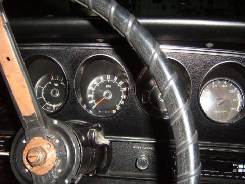 1973 Ford Ranchero - Dashboard gauges of a 1973 Ford Ranchero, including fuel, speedometer, and tachometer.