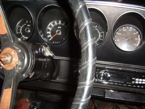 1973 Ford Ranchero - The dashboard features multiple gauges and an aftermarket radio, with visible wear on the steering column.