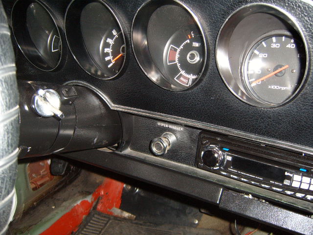 1973 Ford Ranchero interior dashboard with gauges, ignition, wiper washer switch, and radio