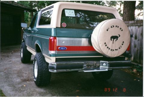 1990 Ford Bronco - The rear view of a 1990 Ford Bronco shows its distinctive body style and spare tire.