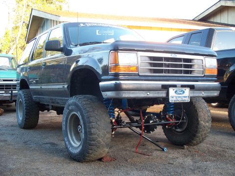 1977 Ford F-150 - This modified Ford Explorer features an aggressive lift kit and oversized tires, clearly not a 1977 Ford F-150.