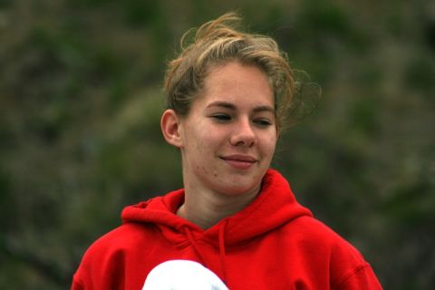 1990 Chevrolet Suburban - A young woman with her hair up wears a red hooded sweatshirt.