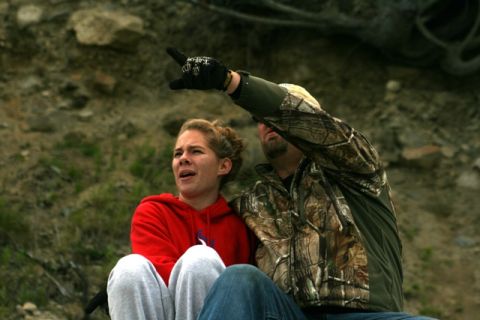 1990 Chevrolet Suburban - Two people are looking and pointing at something in the distance.