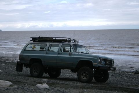 1990 Chevrolet Suburban - Chevrolet K5 Blazer on a beach, likely modified for off-roading.