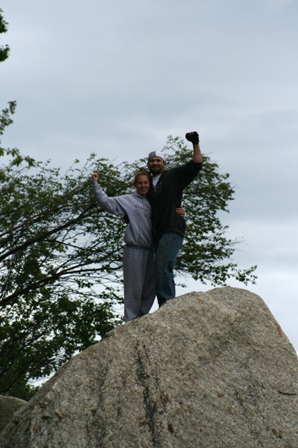1990 Chevrolet Suburban - Two people celebrate on a rock formation at Captain Cook State Park.