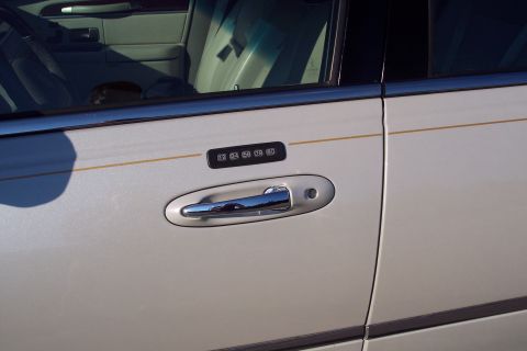 2001 Ford Crown Victoria - Keypad entry system on the driver's side door of a Lincoln Town Car.