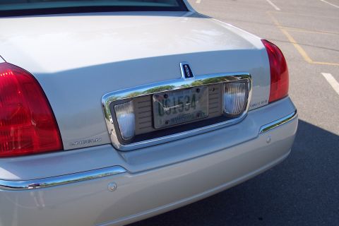 2001 Ford Crown Victoria - The rear of a Lincoln Town Car is shown, with its license plate and taillights visible.
