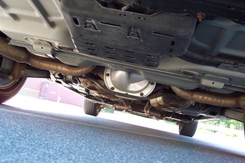 2001 Ford Crown Victoria - Undercarriage of a 2001 Ford Crown Victoria, revealing the exhaust system and rear differential.