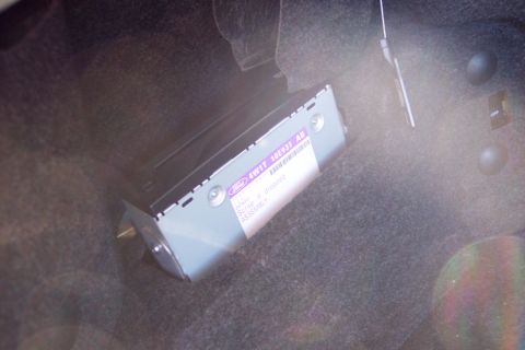 2001 Ford Crown Victoria - Close-up of a Ford audio module, part number 4W1T 10E931 AB, installed in a vehicle.
