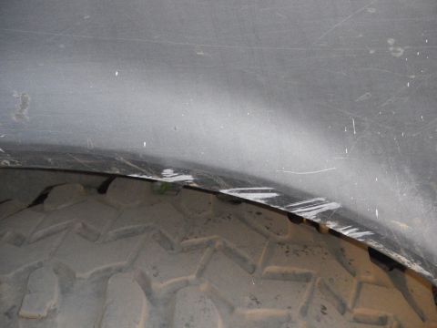 1991 Ford Bronco - This image shows a tire and the interior of a wheel well, not a specific vehicle model.