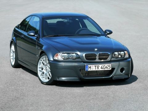 1998 Ford Crown Victoria - A dark gray BMW M3 coupe is shown from the front 3/4 angle on a paved surface.
