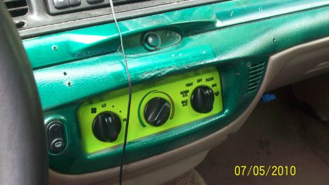 2004 Ford Crown Victoria - Interior view of a 2004 Ford Crown Victoria, showing custom green painted dashboard trim and climate controls.