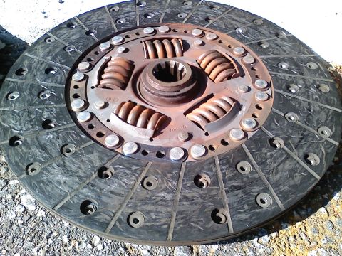 1990 Ford Bronco - A close-up view of a clutch disc, showing its internal springs and friction material.