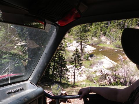 1991 Ford Bronco - View from inside a 1991 Ford Bronco shows a scenic river and wooded area.