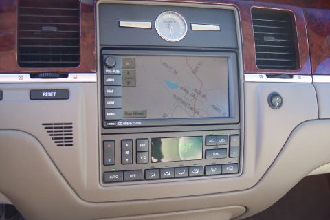 2001 Ford Crown Victoria - Dashboard of a 2004 Lincoln Town Car a navigation system and climate controls.