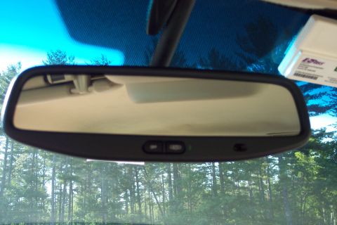 2001 Ford Crown Victoria - View from inside a vehicle, showing the rearview mirror and an EZ-Pass transponder mounted on the windshield.