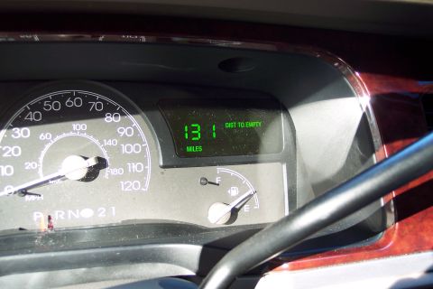 2001 Ford Crown Victoria - The dashboard of a 2004 Lincoln Town Car displays the distance to empty and fuel level.