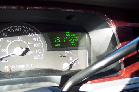 2001 Ford Crown Victoria - Interior view of a vehicle's dashboard, displaying the odometer reading and fuel economy data.