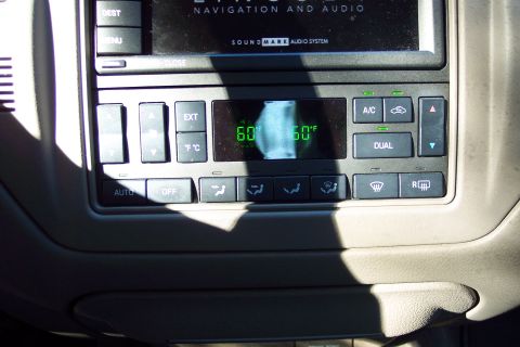 2001 Ford Crown Victoria - The climate control panel displays the external temperature and fan settings.