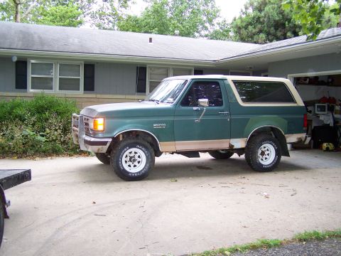 1989 Ford Bronco - This 1989 Ford Bronco is seen in a driveway with a house in the background.