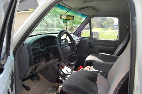 1994 Ford Bronco - Interior view of a 1994 Ford Bronco, showing the dashboard, steering wheel, and seats.