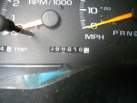 1999 Chevrolet Suburban - Close-up of a vehicle's odometer displaying 96,916 miles and the gear selector in Park.