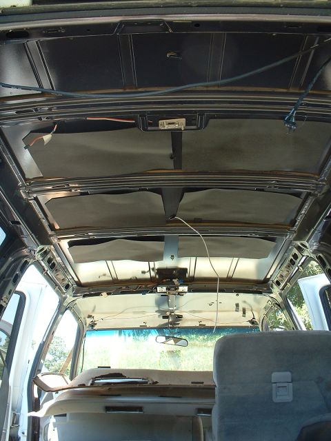 1994 GMC Suburban - The headliner has been removed from this 1994 GMC Suburban, revealing the roof's internal structure and wiring.