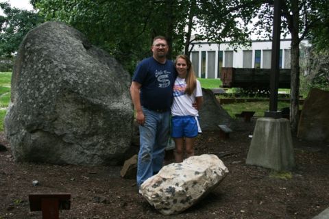 1990 Chevrolet Suburban - A man and a young girl pose for a photo in an outdoor area with large rocks and a building in the background.