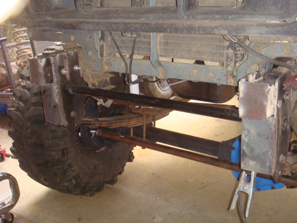 1992 Ford Bronco front axle with large tires and custom suspension modifications