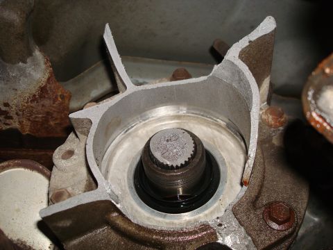 1996 Ford Bronco - Close-up of a damaged automotive part, likely a transmission or transfer case component.