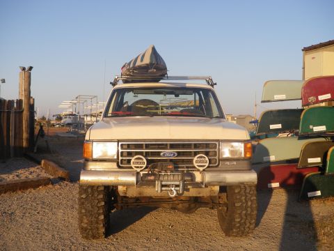 1991 Ford Bronco - This 1991 Ford Bronco is equipped with a roof rack carrying a canoe, ready for an adventure.