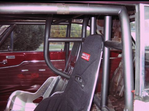 1992 Ford Mustang - Interior view of a modified vehicle racing seats and a full roll cage.