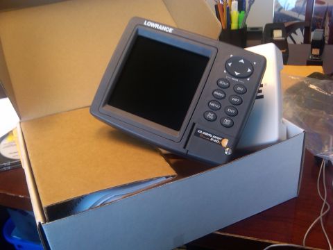 1986 Ford Bronco - A Lowrance GlobalMap 540 GPS unit is shown partially unboxed on a desk.