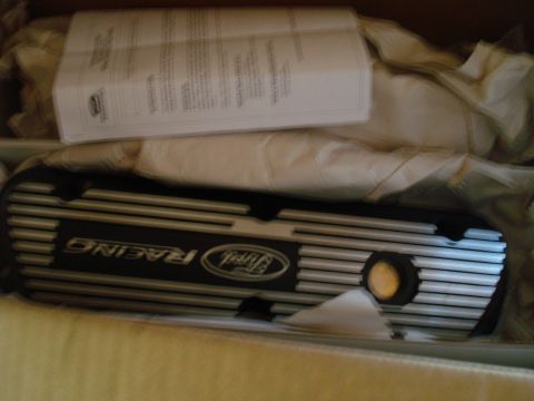 1993 Ford Bronco - A Ford Racing valve cover is shown in its packaging with accompanying documentation.
