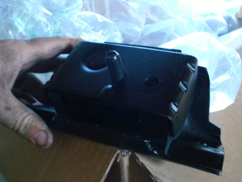 1993 Ford Bronco - A new engine mount is shown, ready for installation.