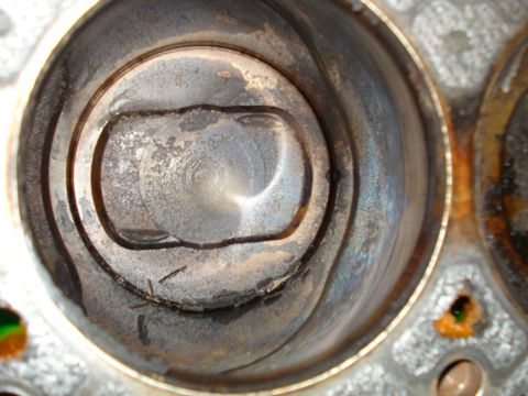 1993 Ford Bronco - Close-up view of an engine cylinder and piston, indicating wear and potential internal damage.