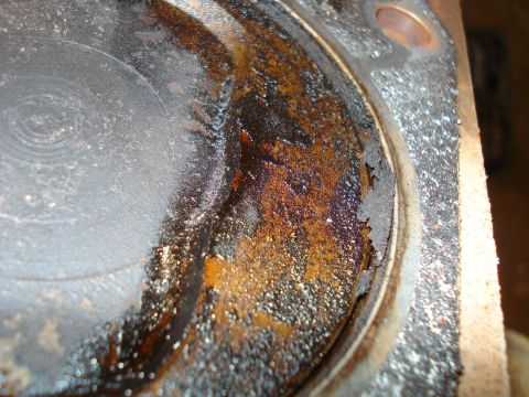 1993 Ford Bronco - This engine piston shows significant damage and wear, indicating a need for replacement or repair.