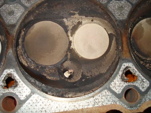 1993 Ford Bronco - This image shows a close-up view of an engine's cylinder head, revealing the condition of its valves and combustion chambers.