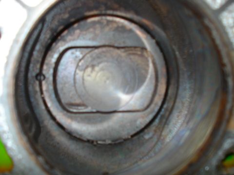 1993 Ford Bronco - Close-up view of an engine cylinder and piston, indicating internal wear and potential maintenance needs.