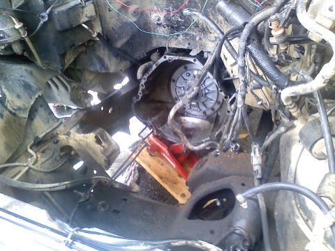 1990 Ford Bronco - Engine bay detail showing transmission and associated components, likely during a repair or swap.