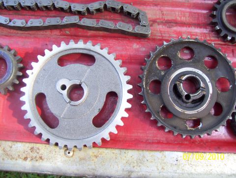 1978 Ford Bronco - Timing chain and gears laid out on a red surface, with a date stamp of 07/09/2010.