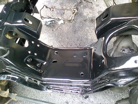 1990 Ford Bronco - This image shows a section of a vehicle's frame, likely during a restoration or modification process.